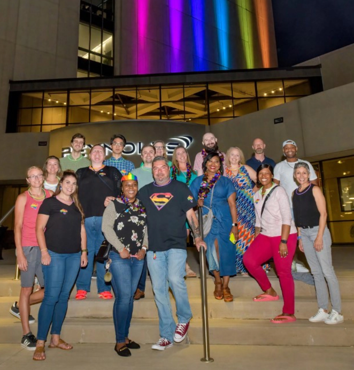 Members of the B United employee resource group, one of Reynolds American's diversity and inclusion programs, standing on steps wearing leis.